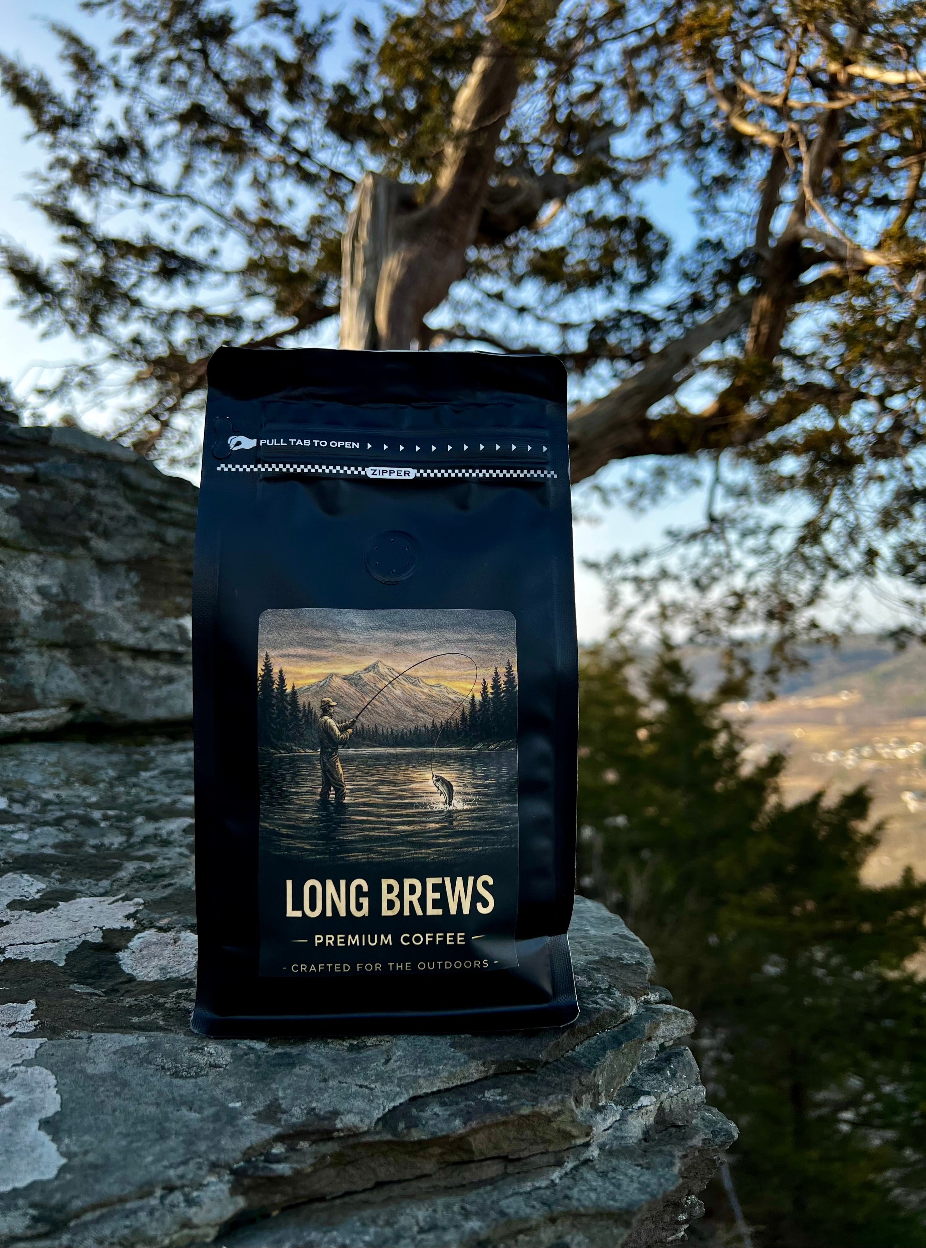 Long Brews premium coffee bag on a rock with a scenic background